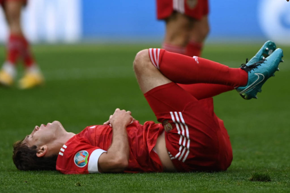 Russia's defender Mario Fernandes is injured during the UEFA EURO 2020 Group B football match between Finland and Russia at the Saint Petersburg Stadium in Saint Petersburg on June 16, 2021. (Photo by Kirill KUDRYAVTSEV / POOL / AFP)