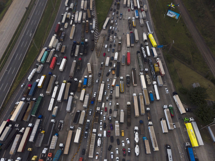 Aerial view showing supporters of President Jair Bolsonaro, mainly truck drivers, blocking Castelo Branco Highway, on the outskirts of Sao Paulo, Brazil, on November 1, 2022. - Supporters of Brazilian President Jair Bolsonaro blocked major highways for a 