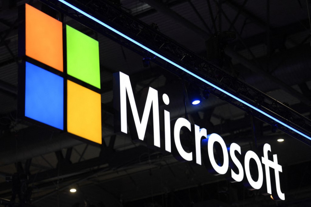 A Microsoft logo is displayed at the MWC (Mobile World Congress) in Barcelona on March 2, 2022. - The Mobile World Congress, where smartphone and telecoms companies show off their latest products and reveal their strategic visions, is expected to welcome 